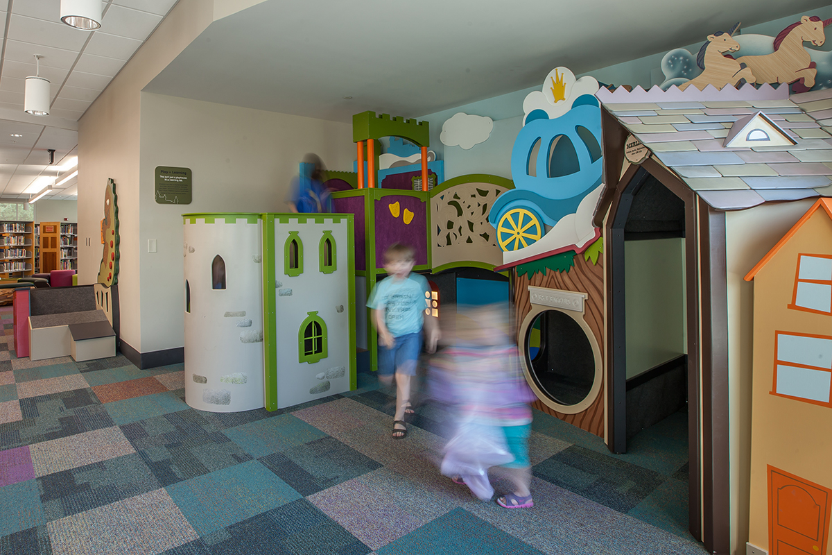 children playing in a carriage nook reading area
